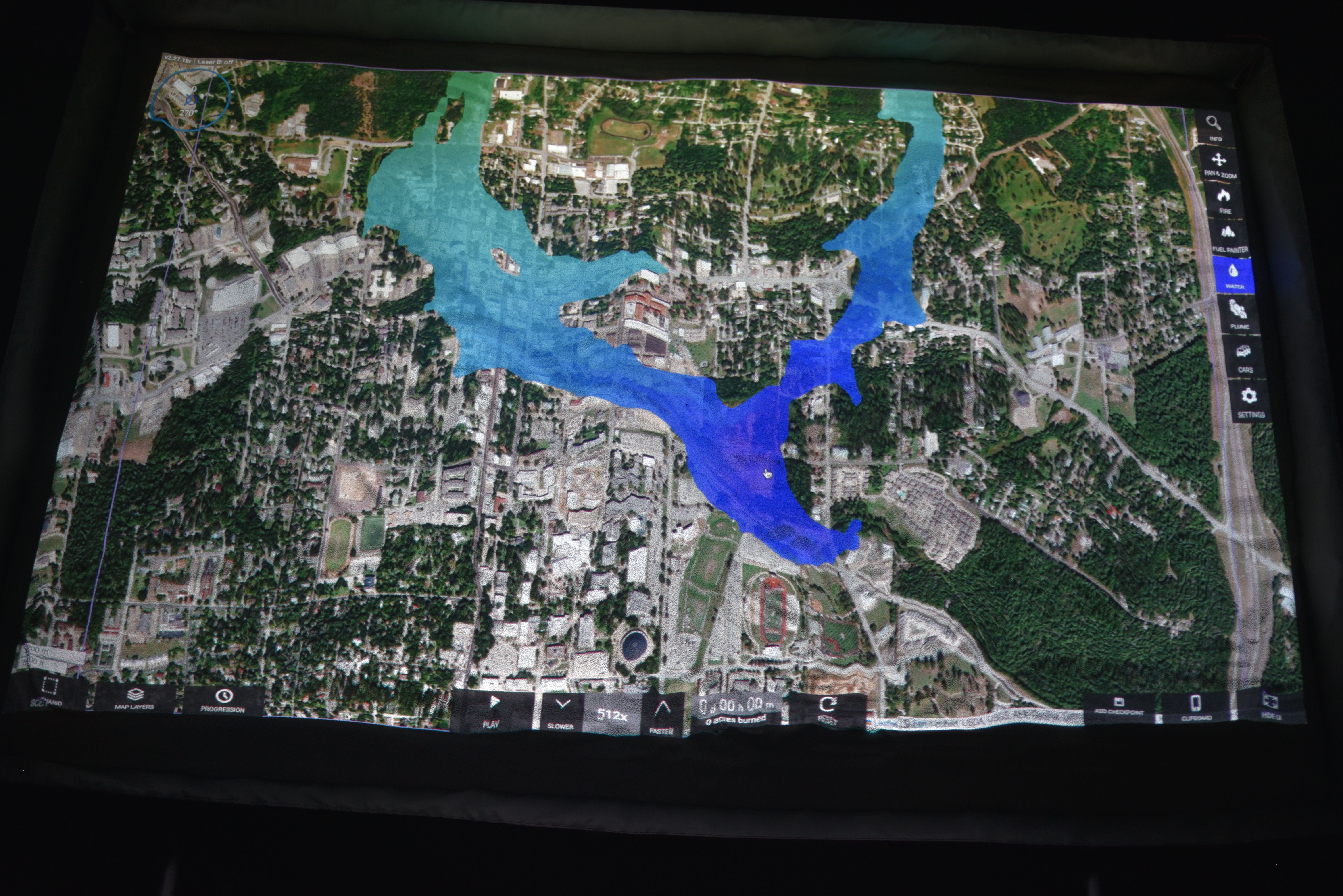 SimTable display showing a flood spreading over an area.